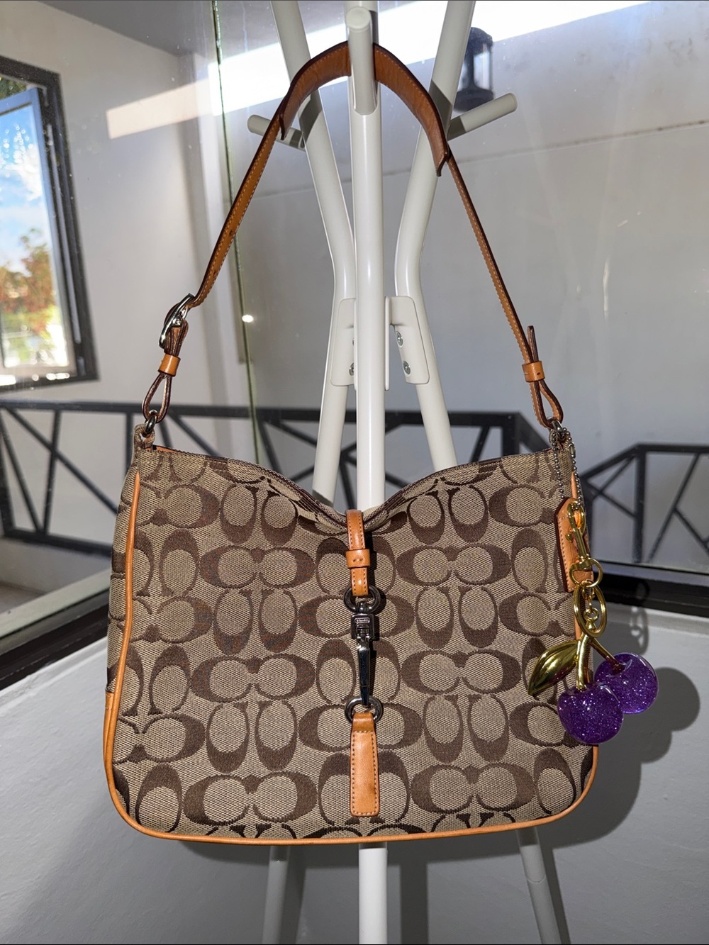 Coach Brown Signature Canvas Shoulder Bag with Tan Trim and Purple Charm